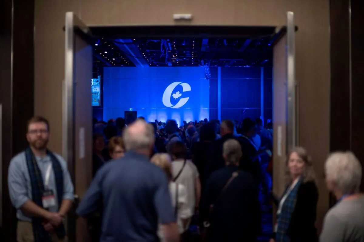 Supporters enter the auditorium for the opening ceremony at the Conservative national convention in Halifax on Aug. 23, 2018.  (The Canadian Press/Darren Calabrese)