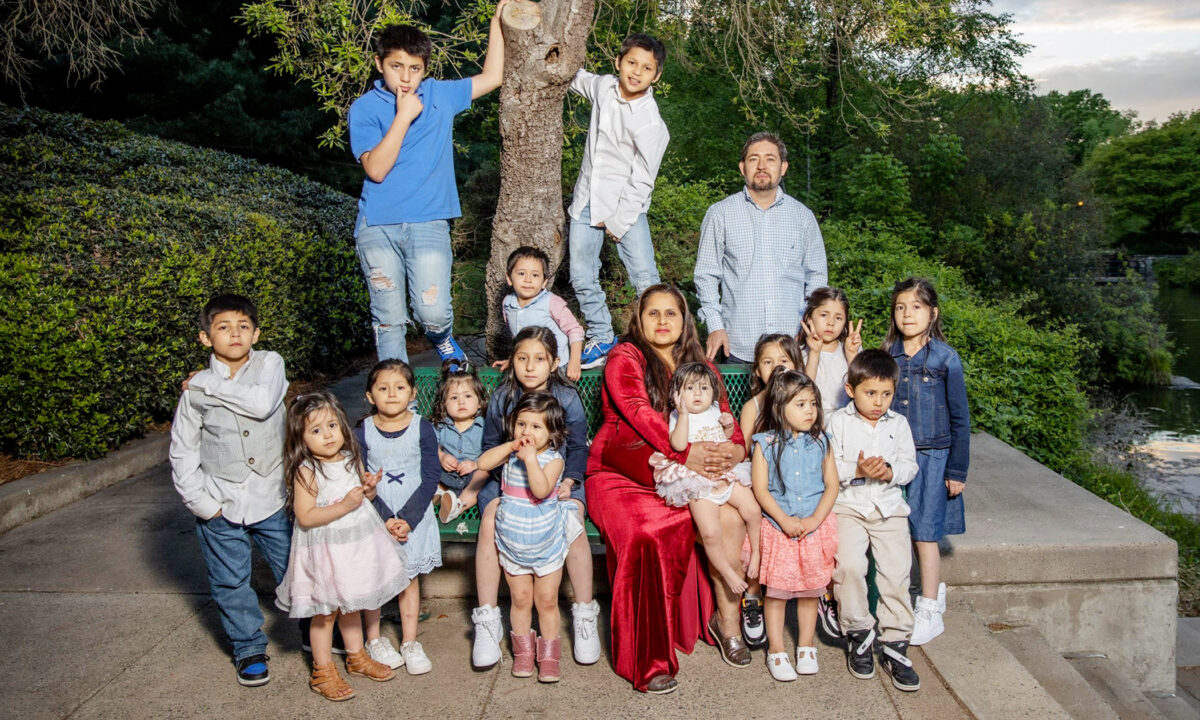 Patty Hernandez and her husband, Carlos, with their 15 children. Patty was pregnant with their 16th child, a baby boy, when this family photo was taken. (Courtesy of Patty Hernandez)