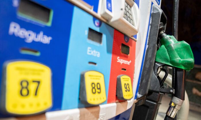 A gasoline pump sits in a holder at an Exxon gas station in Washington, D.C., on March 13, 2022. (Stefani Reynolds/AFP via Getty Images)