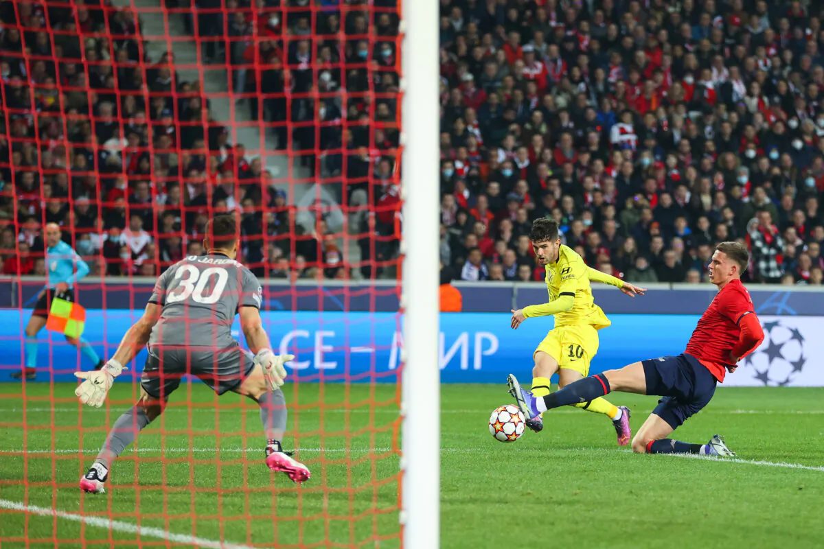 Christian Pulisic of Chelsea scores their sides first goal past Leo Jardim of Lille OSC during a UEFA Champions League match in Lille, France, on March 16, 2022. (Catherine Ivill/Getty Images)