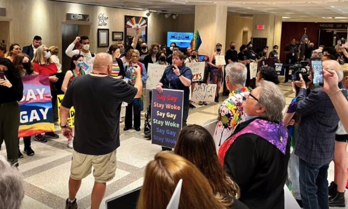 Protestors angry about the Parental Rights in Education bill walk through the Florida Capitol on March 7, 2022. (Kevin Cho Tipton via Storyful)