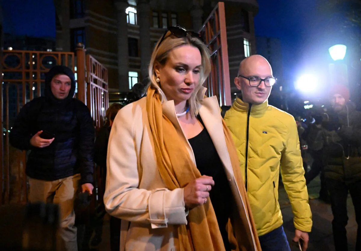 Marina Ovsyannikova, the editor at the state broadcaster Channel One who protested against Russian military action in Ukraine during the evening news broadcast at the station late March 14, leaves the Ostankinsky District Court after being fined for 30,000 rubles (about $270) for breaching protest laws in Moscow on March 15, 2022. (AFP via Getty Images)