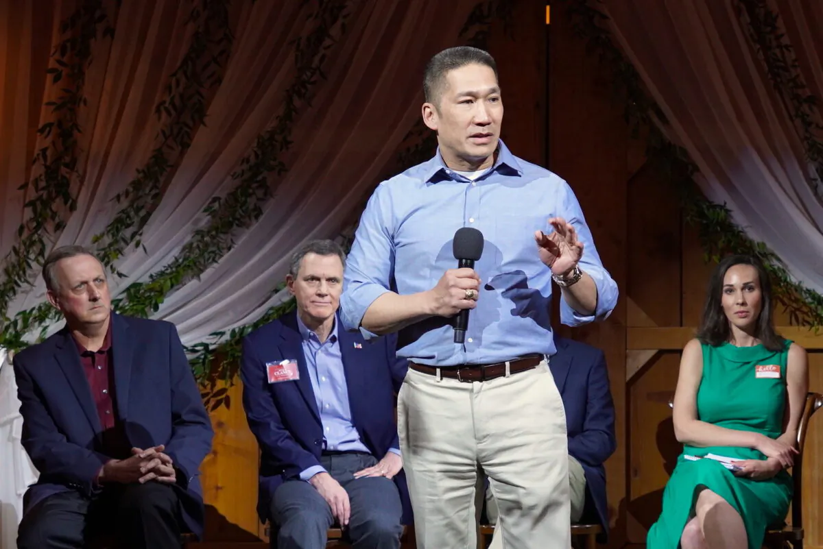 Hung Cao, then-Republican congressional candidate for the 10th District of Virginia, speaks at a Patriot Pub forum in Hamilton, Va., on Mar. 17, 2022. Seated (L to R) are David Beckwith, Mike Clancy, and Brooke Taylor. (Terri Wu/The Epoch Times)