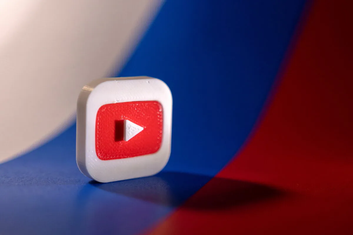 A Youtube logo is placed on a Russian flag in this illustration picture taken on Feb. 26, 2022. (Dado Ruvic/Illustration/Reuters)