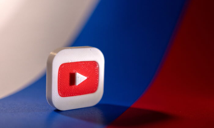 A Youtube logo is placed on a Russian flag in this illustration picture taken on Feb. 26, 2022. (Dado Ruvic/Illustration/Reuters)