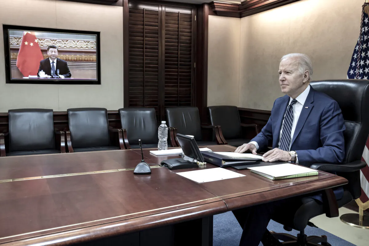 U.S. President Joe Biden holds virtual talks with Chinese leader Xi Jinping from the Situation Room at the White House in Washington, on March 18, 2022.  (The White House via AP)