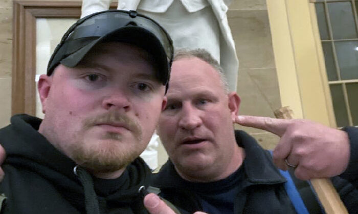 Jacob Fracker, 30, a former Virginia police officer, pleaded guilty to a felony charge of conspiracy to obstruct counting of electoral votes on Jan. 6, 2021. He posed for this selfie with co-defendant Thomas Robertson in the Capitol Crypt. (U.S. Department of Justice/Screenshot via The Epoch Times)