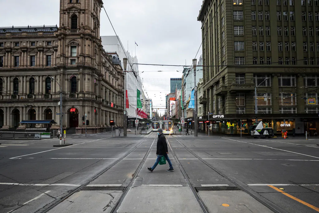 A person crosses Bourke Street in Melbourne, Australia, on July 20, 2021. (Daniel Pockett/Getty Images)