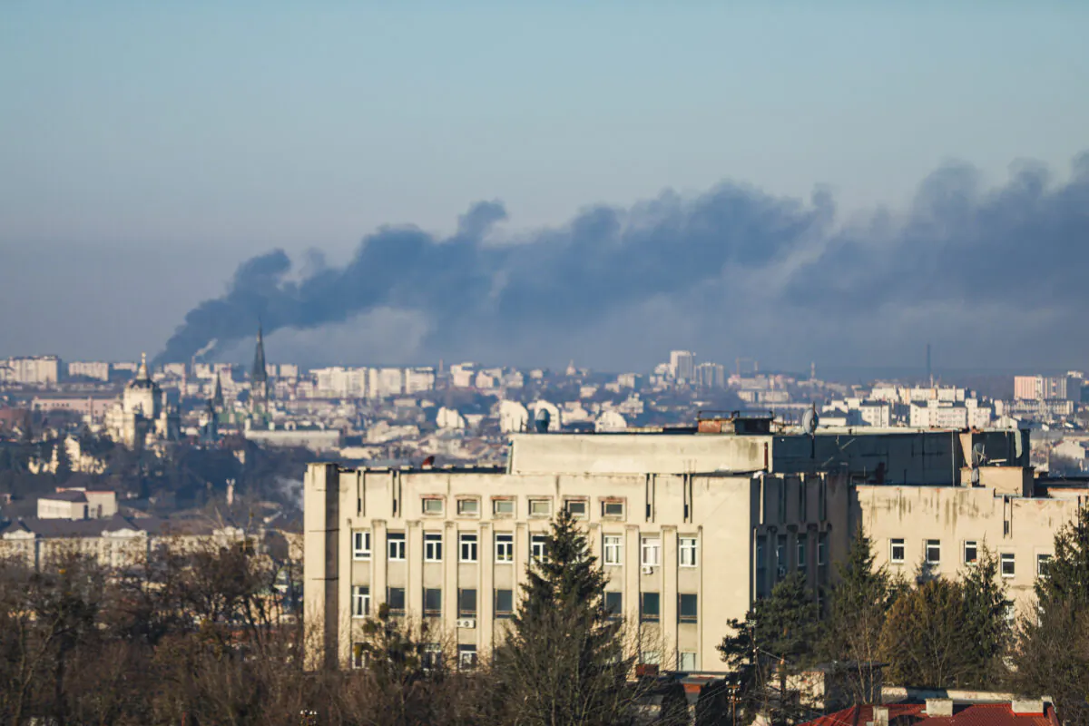 Smoke billows out from the Lviv Airport after an early morning air strike hit an aircraft repair plant, in Lviv, Ukraine, on March 18, 2022. (Charlotte Cuthbertson/The Epoch Times)