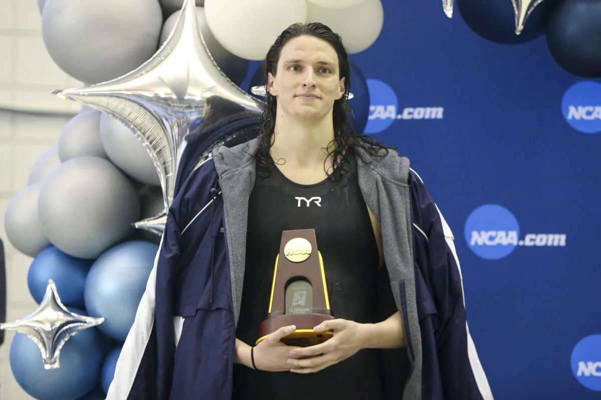 Penn Quakers transgender swimmer Lia Thomas holds a trophy after finishing first in the 500 freestyle at the NCAA Womens Swimming & Diving Championships at Georgia Tech. (Brett Davis/USA Today Sports)