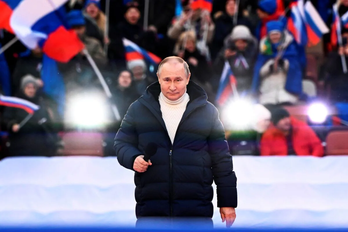 Russian President Vladimir Putin delivers his speech at the concert marking the eighth anniversary of the referendum on the state status of Crimea and Sevastopol and its reunification with Russia, in Moscow, on March 18, 2022. (Sergei Guneyev/Sputnik Pool Photo via AP)
