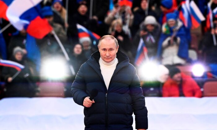 Russian President Vladimir Putin delivers his speech at the concert marking the eighth anniversary of the referendum on the state status of Crimea and Sevastopol and its reunification with Russia, in Moscow, on March 18, 2022. (Sergei Guneyev/Sputnik Pool Photo via AP)