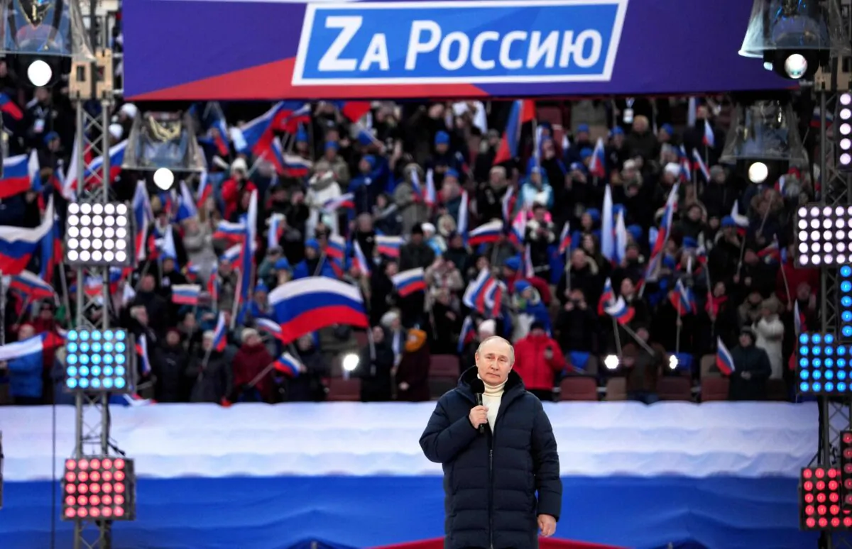 Russian President Vladimir Putin gives a speech during a concert marking the eighth anniversary of Russia's annexation of Crimea at the Luzhniki stadium in Moscow, on March 18, 2022. (Alexander Vilf/Pool/AFP via Getty Images)