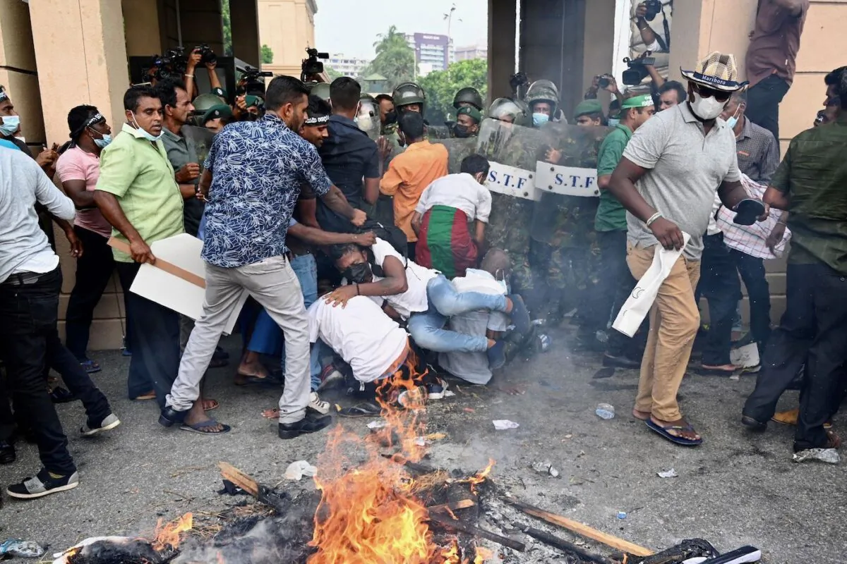 Opposition activists protest against rising living costs at the entrance of the president's office in Colombo, Sri Lanka, on March 15, 2022. (Ishara S. Kodikara/AFP via Getty Images)