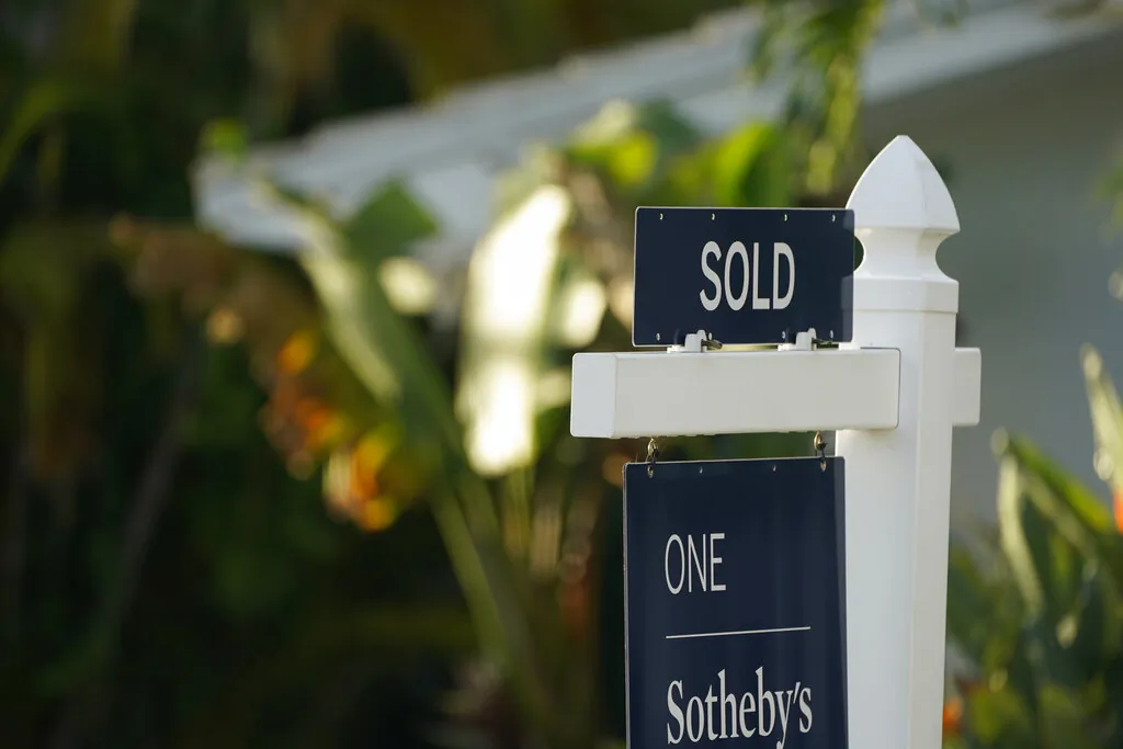 A sold sign is shown in front of a home in Surfside, Fla., on Sept. 20, 2021. (AP Photo/Wilfredo Lee)