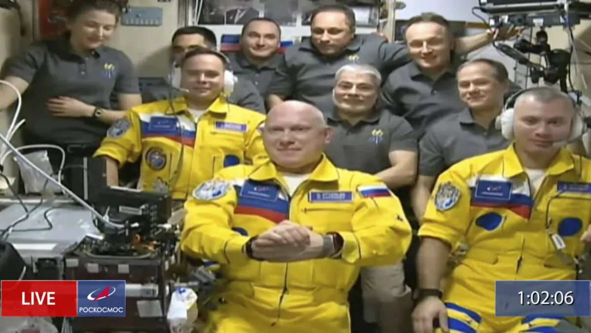 Russian cosmonauts Sergey Korsakov, Oleg Artemyev, and Denis Matveyev during a welcome ceremony after arriving at the International Space Station, on March 18, 2022, in in this frame grab from video. (Roscosmos via AP)