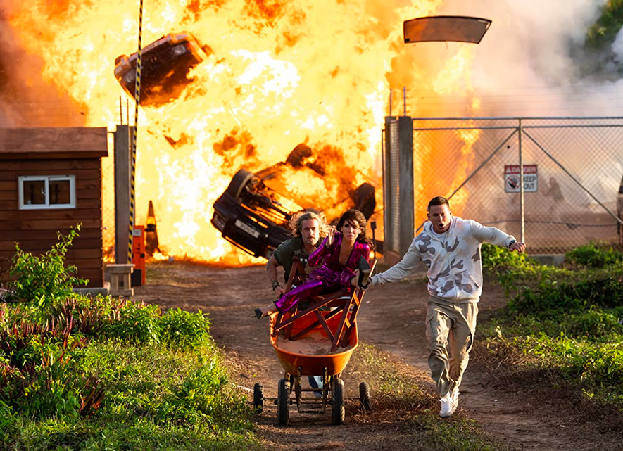 two men and a woman flee an explosion in THE LOST CITY