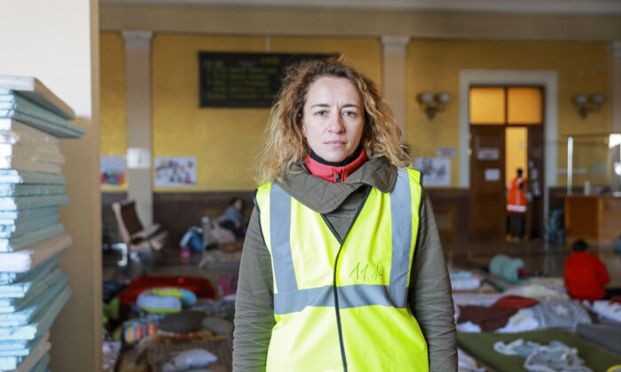 Anna Pryimenko, a volunteer, stands in a room for refugee mothers and children at the train station in Lviv, Ukraine, on March 18, 2022. (Charlotte Cuthbertson/The Epoch Times)