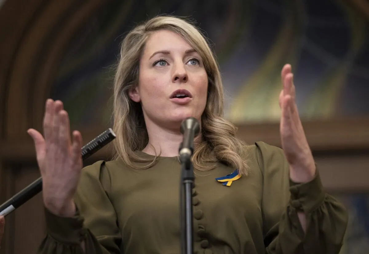 Foreign Affairs Minister Melanie Joly responds to questions in the Foyer of the House of Commons in Ottawa, March 15, 2022.(The Canadian Press/Adrian Wyld)