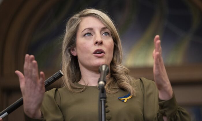 Foreign Affairs Minister Melanie Joly responds to questions in the Foyer of the House of Commons in Ottawa, March 15, 2022.(The Canadian Press/Adrian Wyld)