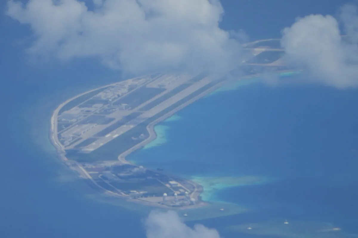 An airstrip made by China is seen beside structures and buildings at the man-made island on Mischief Reef in the Spratlys group of islands, in the South China Sea, on March 20, 2022. (Aaron Favila/AP Photo)