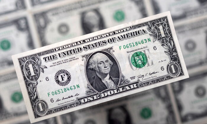U.S. dollar banknotes are displayed in this illustration taken, on Feb. 14, 2022. (Dado Ruvic/Illustration/Reuters)