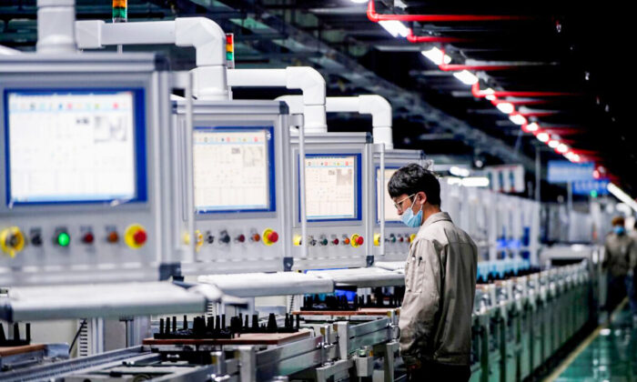 An employee works on the production line of electric vehicle (EV) battery manufacturer Octillion in Hefei, Anhui province, China, on March 30, 2021. (Aly Song/Reuters)