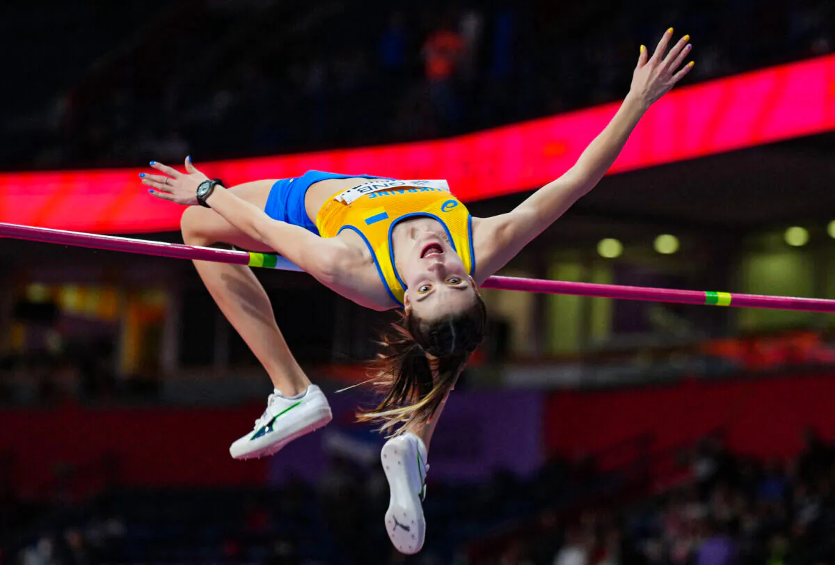 Ukraine's Yaroslava Mahuchikh in action during her final jump to win the women's high jump final at the World Athletics Indoor Championships in Belgrade, Serbia, on March 19, 2022. (Aleksandra Szmigiel/Reuters)