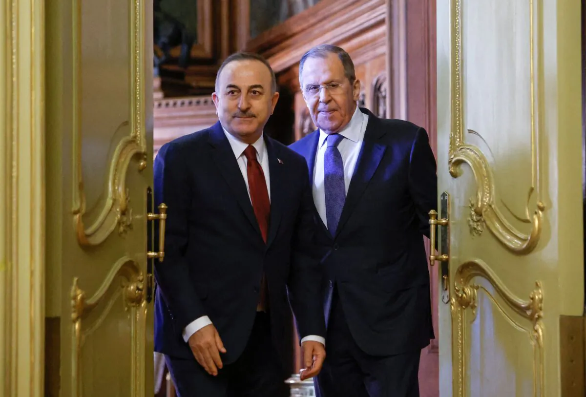 Russian Foreign Minister Sergei Lavrov (R) and his Turkish counterpart Mevlut Cavusoglu arrive to hold a joint press conference following their talks in Moscow on March 16, 2022. (Maxim Shemetov/Pool/AFP via Getty Images)