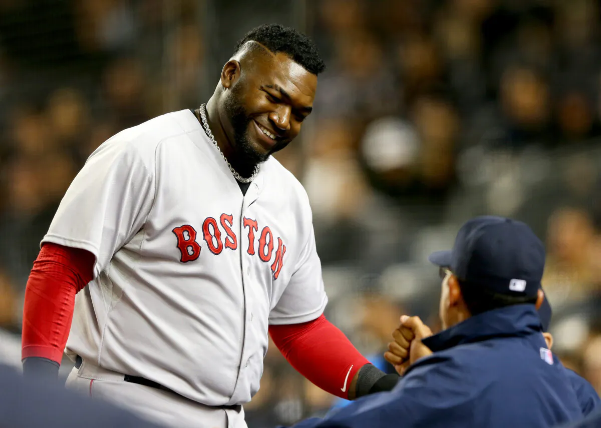 David Ortiz (34) of the Boston Red Sox celebrates after he scored a run in the fourth inning against the New York Yankees, at Yankee Stadium in the Bronx borough of New York on April 12, 2015. (Elsa/Getty Images)