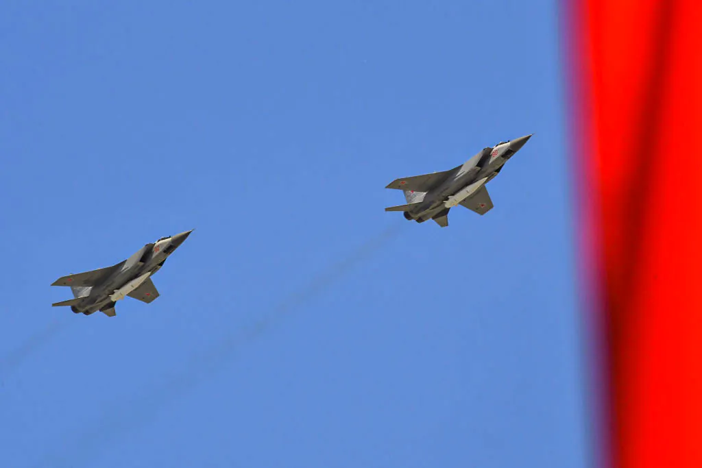 Russia's MiG-31 supersonic interceptor jets carrying hypersonic Kinzhal (Dagger) missiles fly over the Red Square during a military parade in Moscow, Russia, on May 9, 2018. (Yuri Kadobnov/AFP via Getty Images)