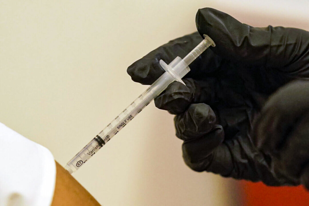 A person is injected with Pfizer's COVID-19 vaccine in Dallas, Texas, in a file image. (LM Otero/AP Photo)