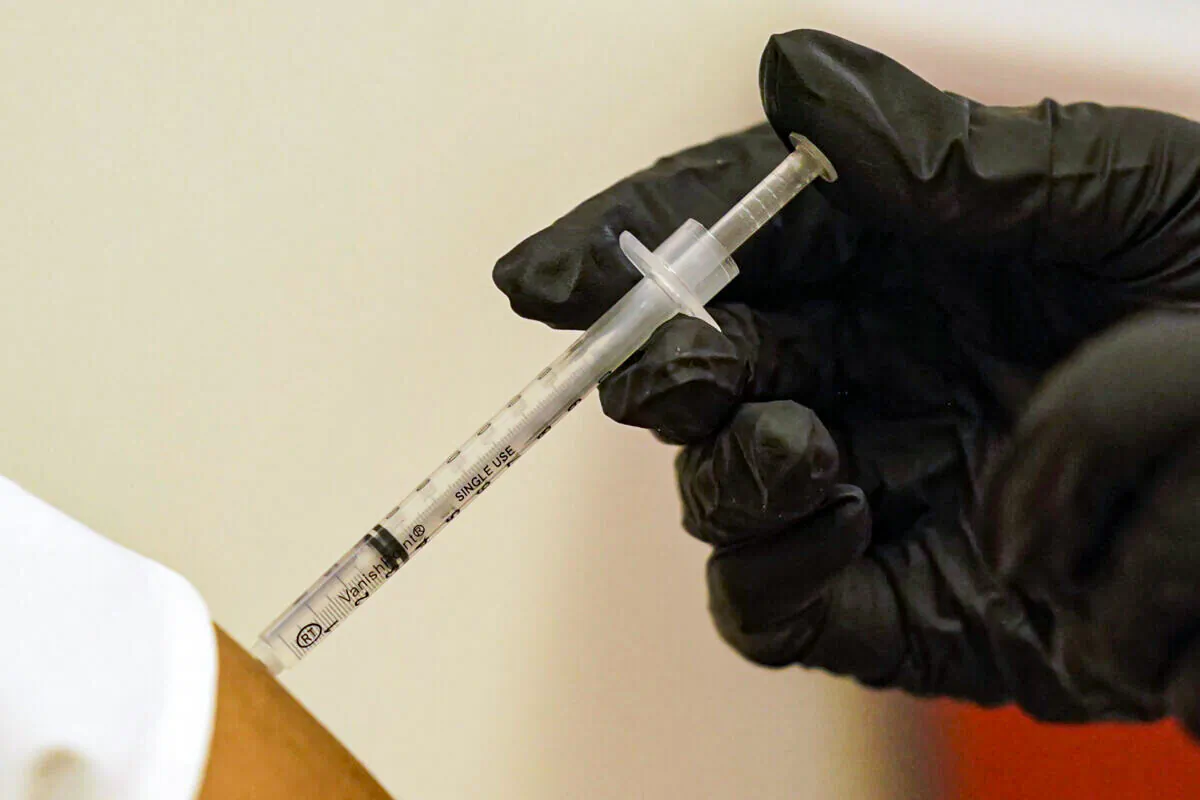 A person is injected with Pfizer's COVID-19 vaccine in Dallas in this undated file photo. (LM Otero/AP Photo)
