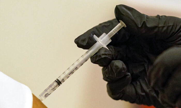 A person is injected with Pfizer's COVID-19 vaccine in Dallas in this undated file photo. (LM Otero/AP Photo)