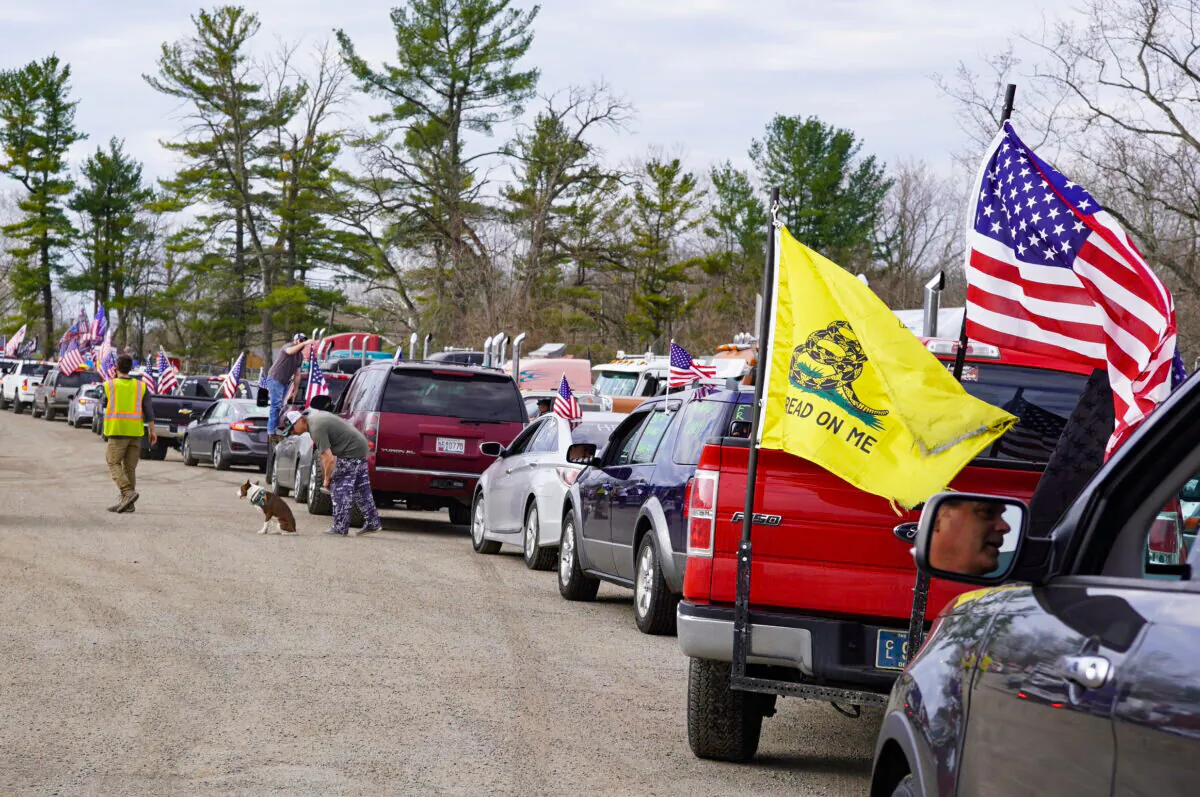 Trucks and cars line up to leave Hagerstown Speedway in Hagerstown, Md., on Mar. 19, 2022, to loop the Capital Beltway. (Terri Wu/The Epoch Times)