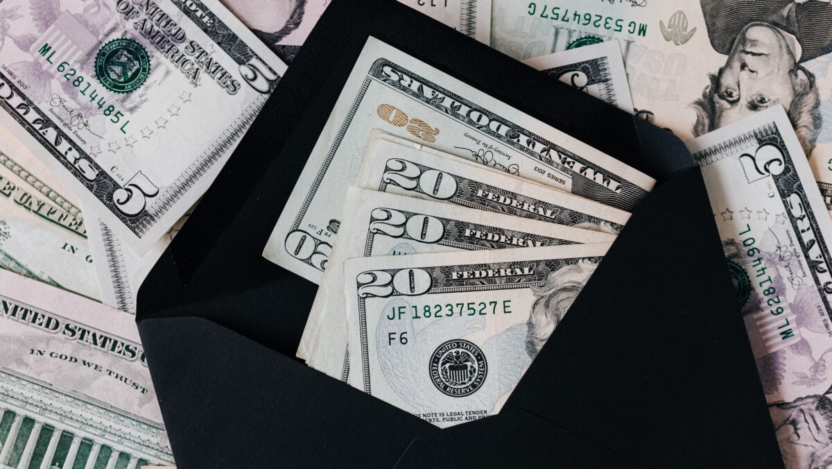 Stock photo of dollar notes and a wallet. (Karolina Grabowska/Pexels)