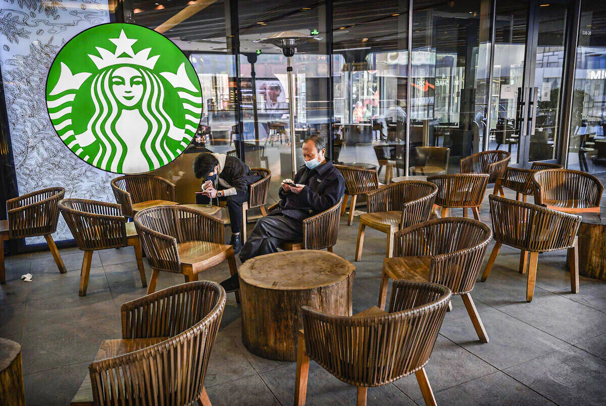 Customers sit in a nearly empty Starbucks in Beijing, China on March 10, 2020. (Kevin Frayer/Getty Images)