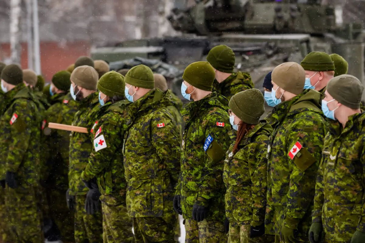 Canadian soldiers wait to meet Minister of Defence Anita Anand in Adazi, Latvia, on Feb. 3, 2022. (Gints Ivuskans/AFP via Getty Images)