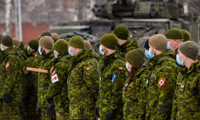 Canadian soldiers wait to meet Minister of Defence Anita Anand in Adazi, Latvia, on Feb. 3, 2022. (Gints Ivuskans/AFP via Getty Images)