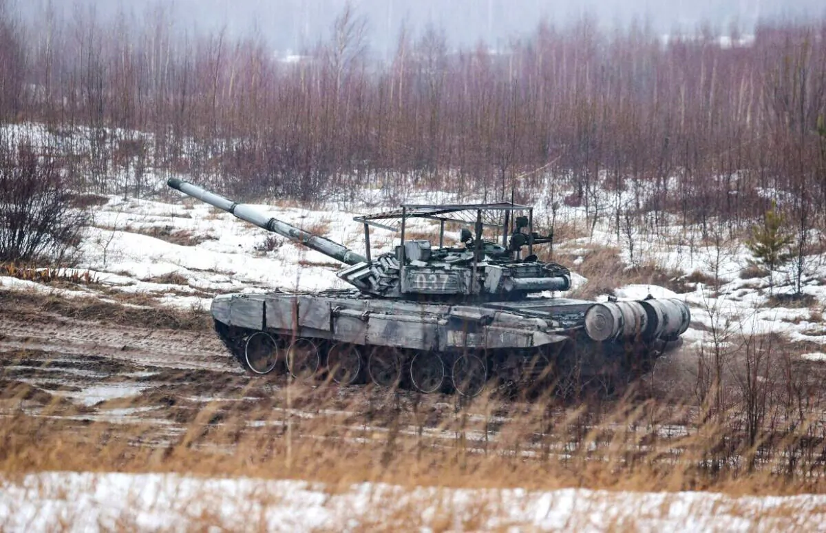 A tank moves along a field during joint exercises of the armed forces of Russia and Belarus near Minsk on Feb. 17, 2022. (Maxim Guchek/BELTA/AFP via Getty Images)