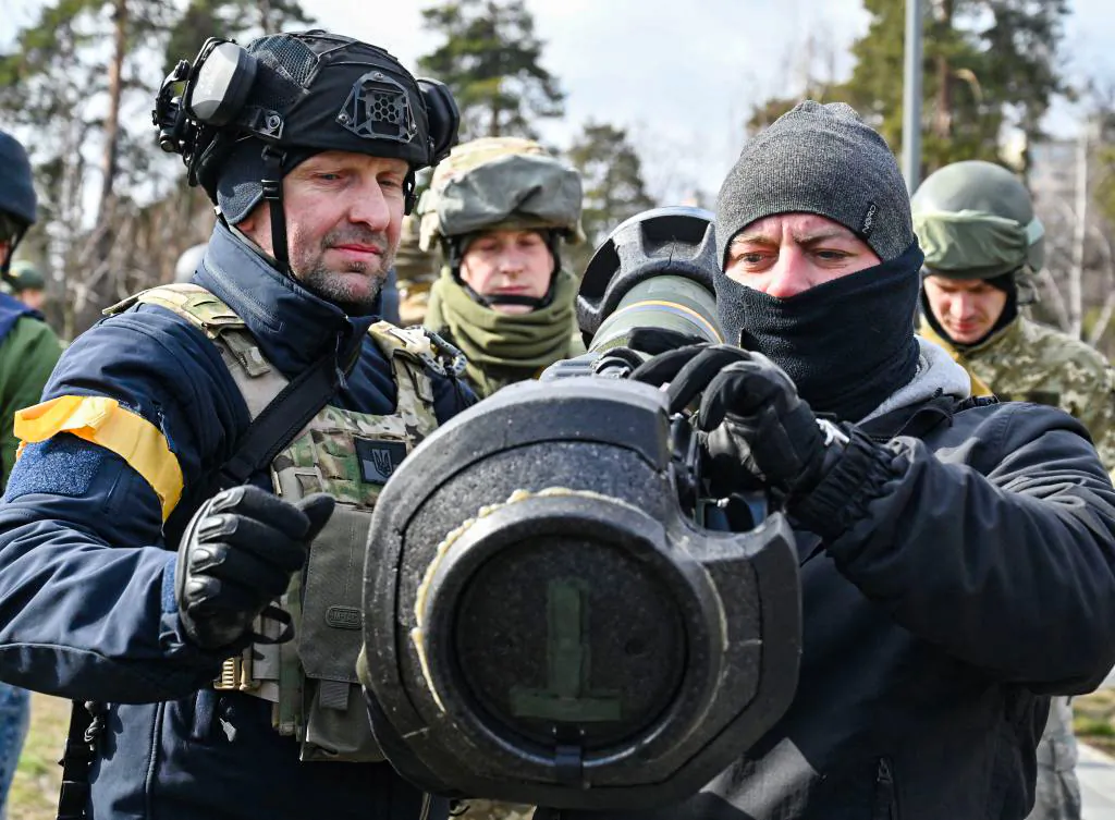 Members of the Ukrainian Territorial Defense Forces examine new armament, including NLAW anti-tank systems and other portable anti-tank grenade launchers, in Kyiv, on March 9, 2022. (Genya Savilov/AFP via Getty Images)
