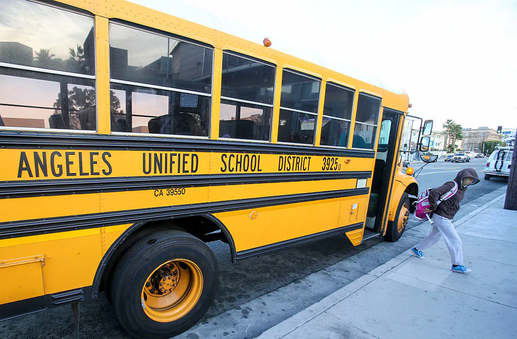 Students arrive at a school in Los Angeles on Dec. 16, 2015. (Ringo Chiu/AFP via Getty Images)
