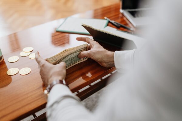 People counting dollar notes