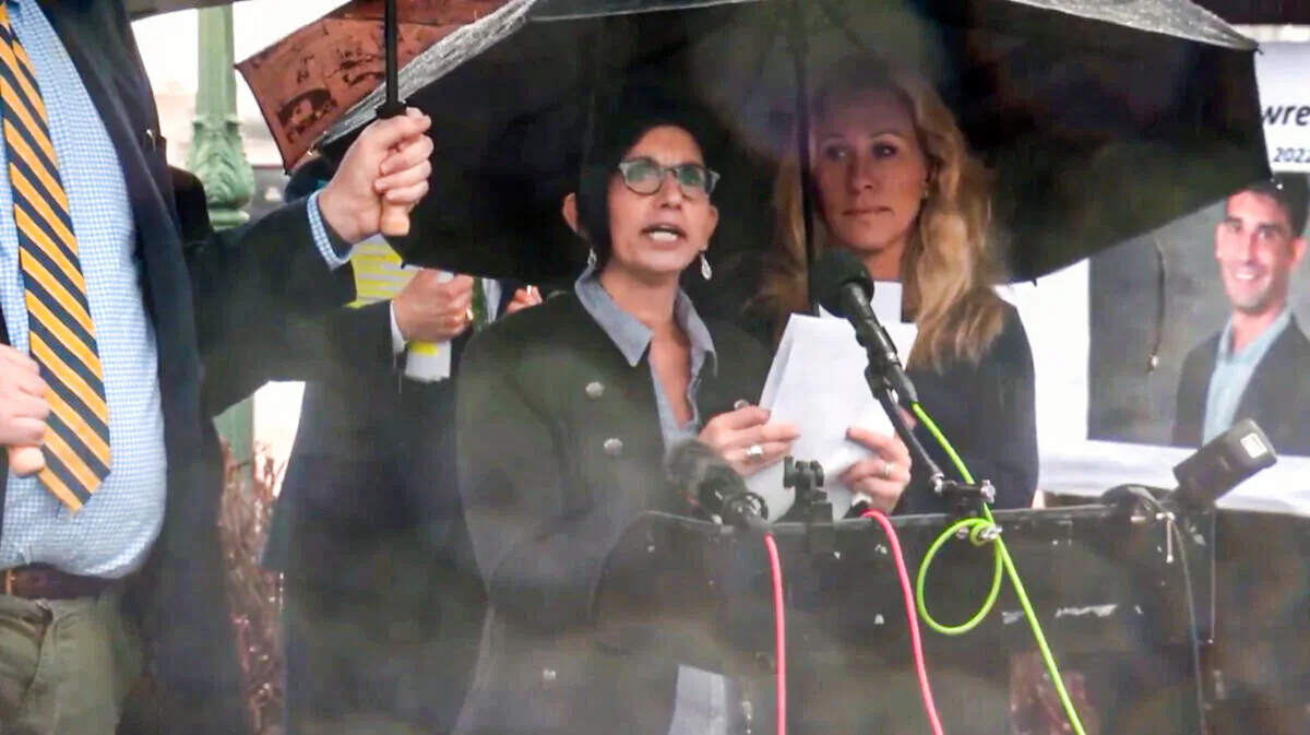 Geri Perna discusses the Feb. 25 suicide of her nephew, Matthew L. Perna, at a Capitol Hill news conference on March 17, 2022. At right is Rep. Marjorie Taylor Greene, R-Georgia. (Rep. Louie Gohmert Rumble/Screenshot via The Epoch Times)