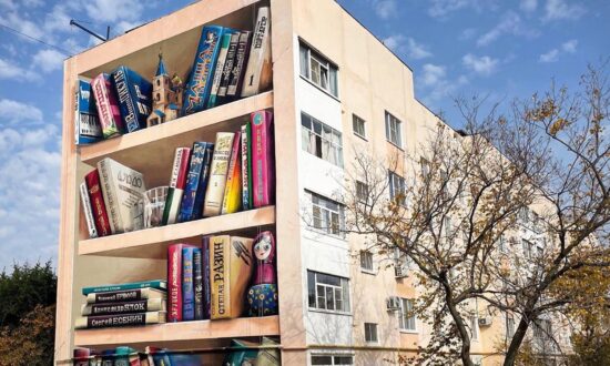 Optical Illusion Artist Transforms Dingy Soviet-Style Apartment Building Into Giant 3D Bookshelf in Russia