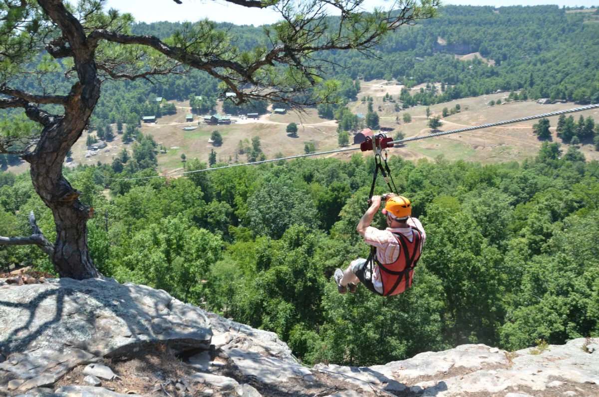 A guest tries zip-lining at Horseshoe Canyon Ranch in Jasper, Ark. (Photo courtesy of Horseshoe Canyon Ranch)