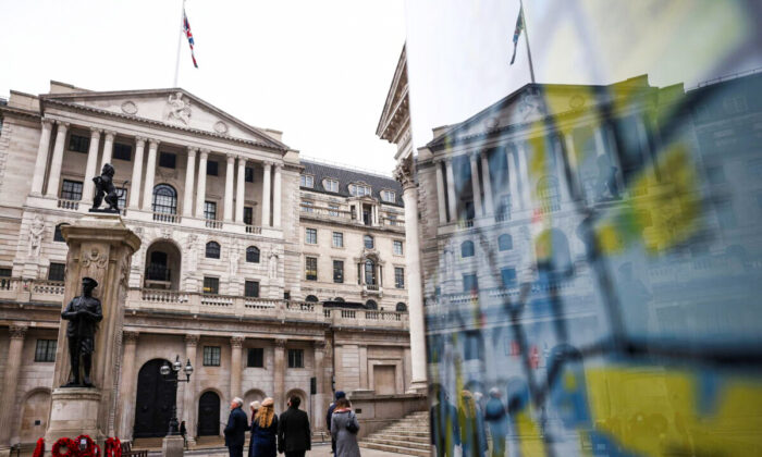 People stand outside the Bank of England in London on Jan. 23, 2022. (Henry Nicholls/Reuters)