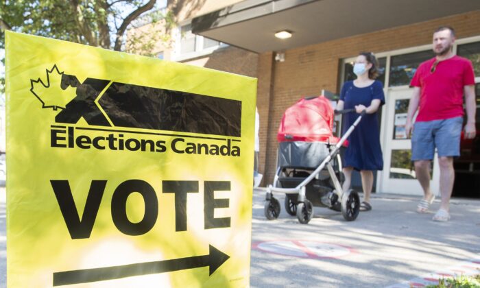 People leave a polling station after voting on federal election day in Montreal on Sept. 20, 2021. (The Canadian Press/Graham Hughes)