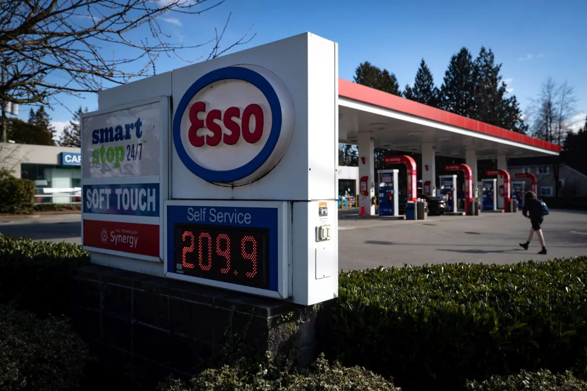 A sign displays the price of a litre of regular grade gasoline at a gas station in Vancouver on March 8, 2022. (The Canadian Press/Darryl Dyck)