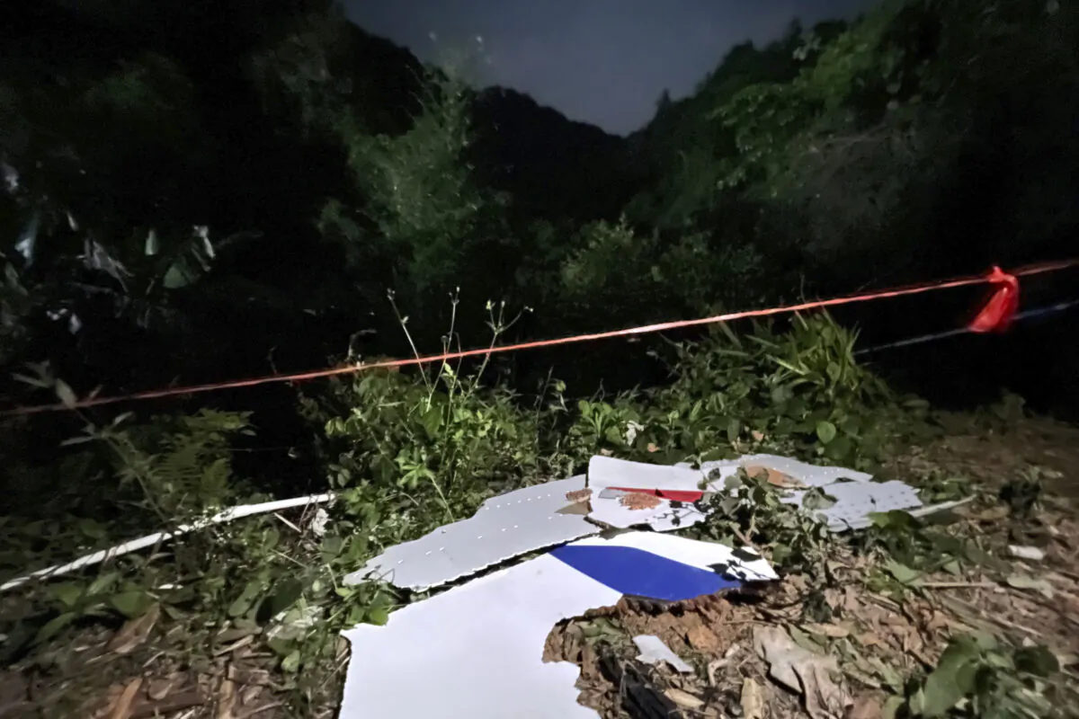 Debris is seen at the site of a plane crash in Tengxian County in southern China's Guangxi Province on March 22, 2022. (Zhou Hua/Xinhua via AP)